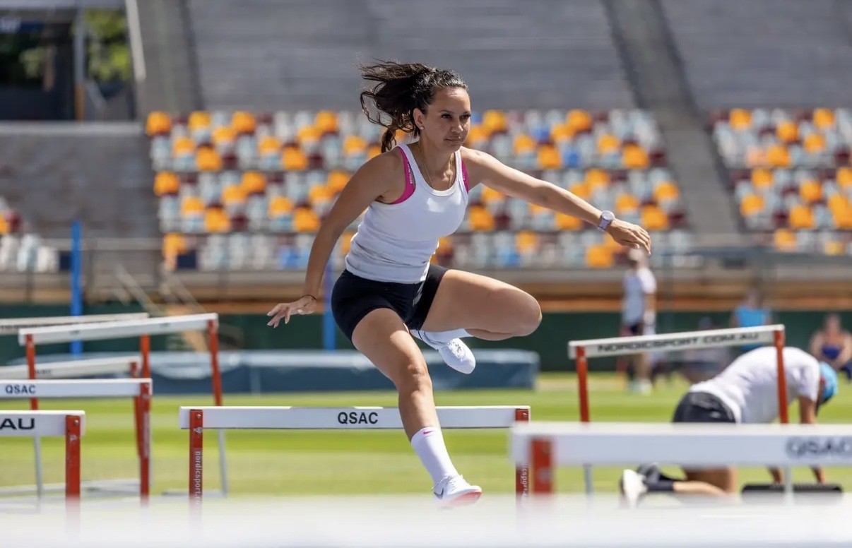 Athlete clearing a hurdle