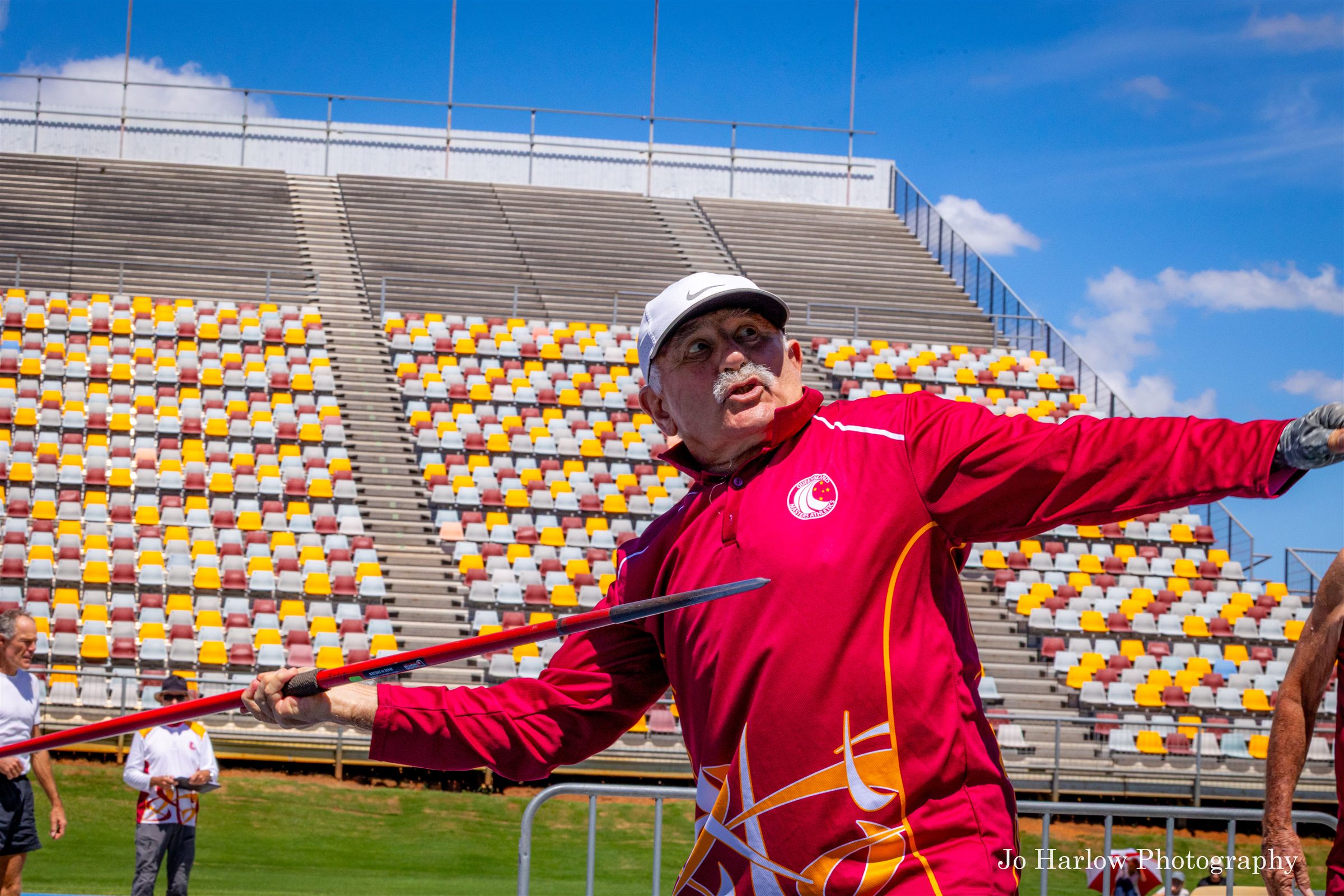 Masters athlete releasing the javelin