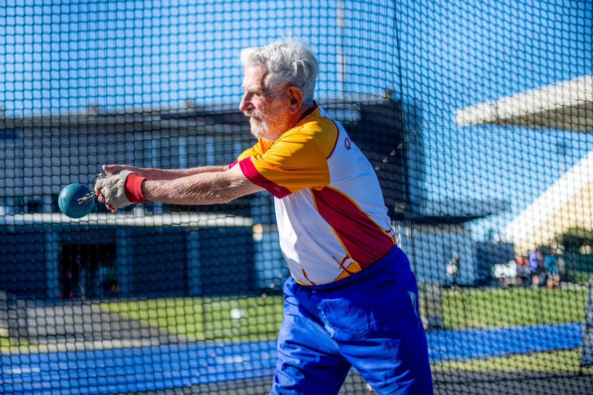 Laurence Quinlivan swinging the hammer inside the throwing cage