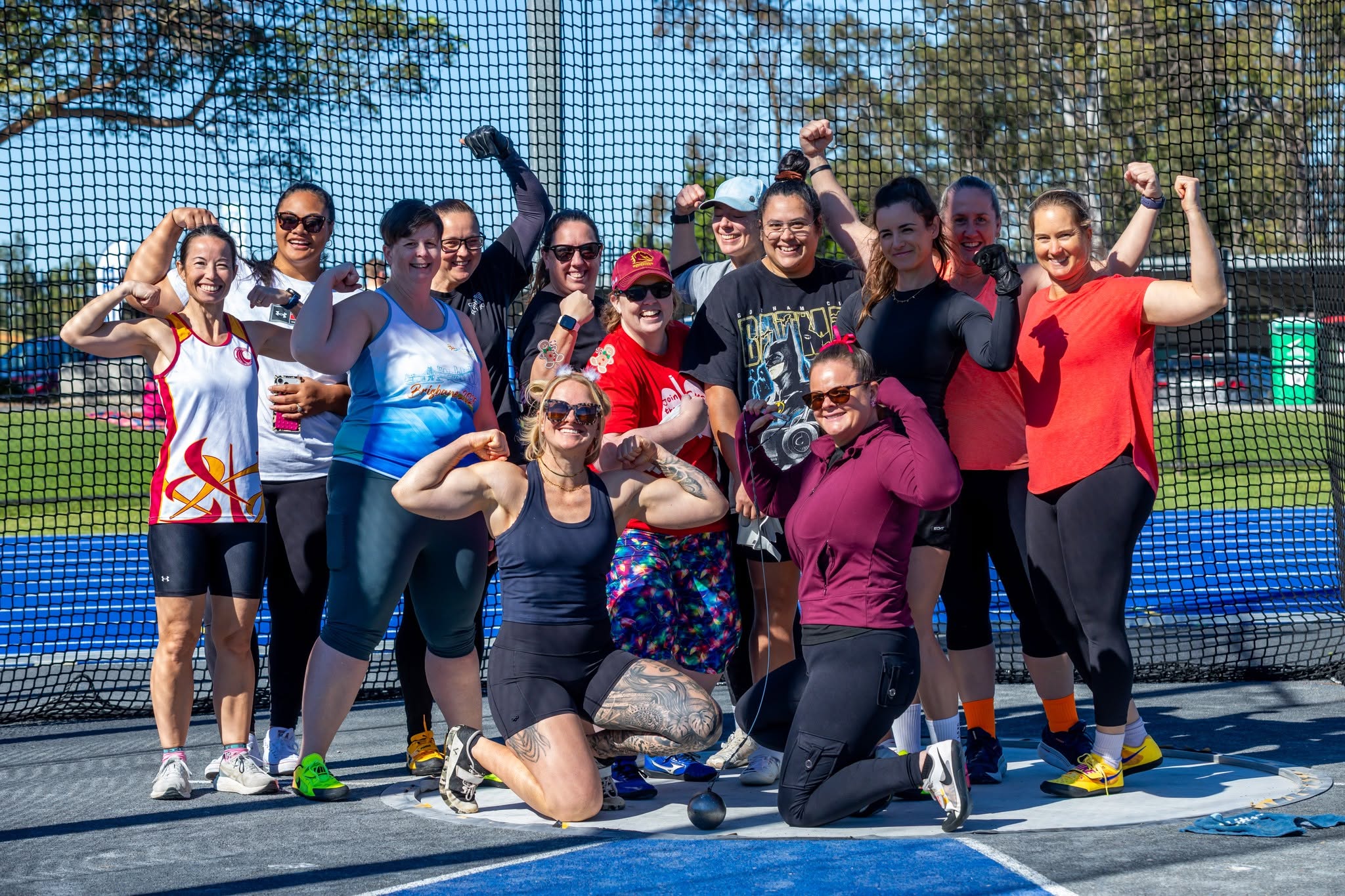 A group of masters throwers at the hammer cage