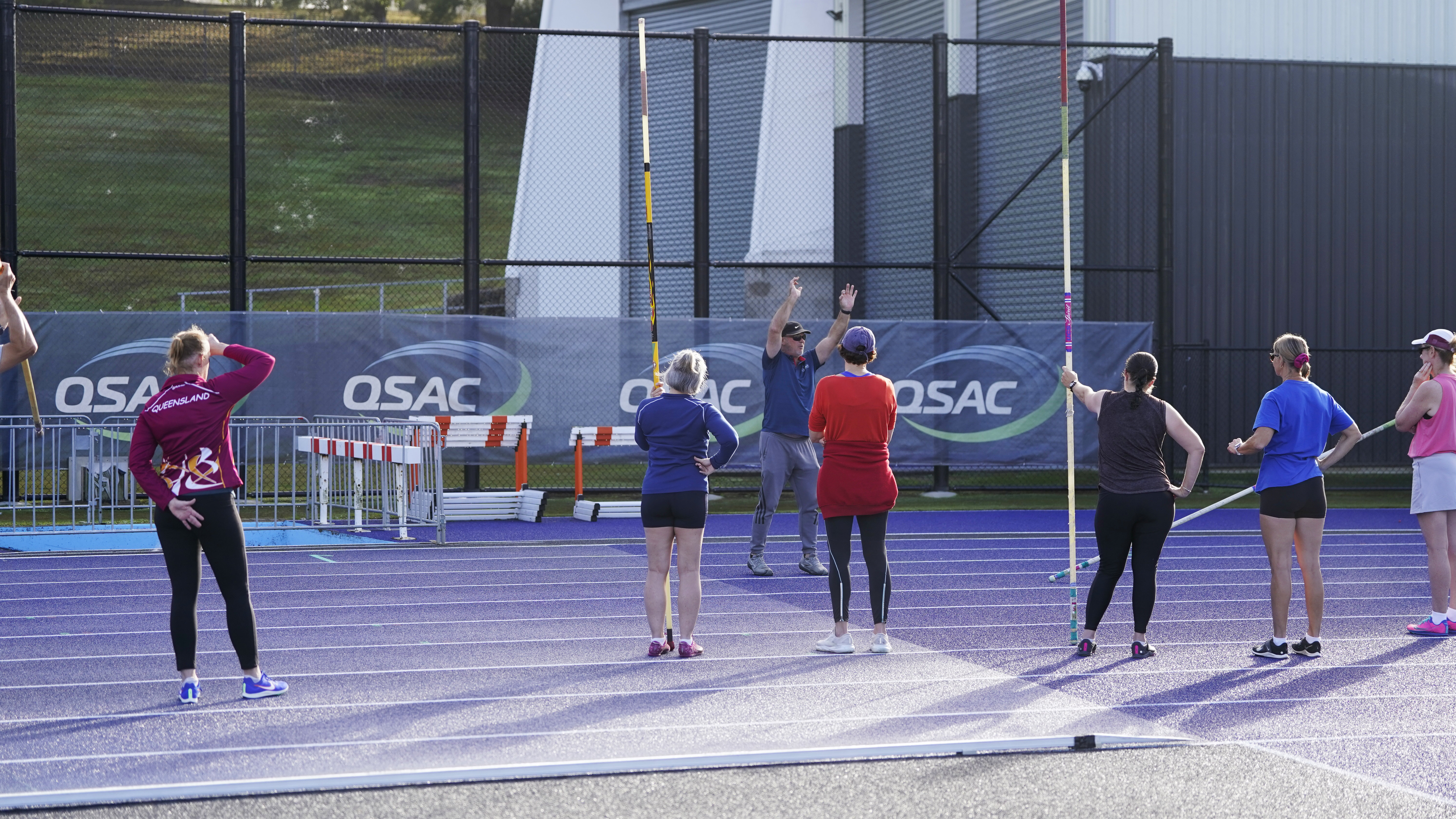 A coach working with an athlete at a training session