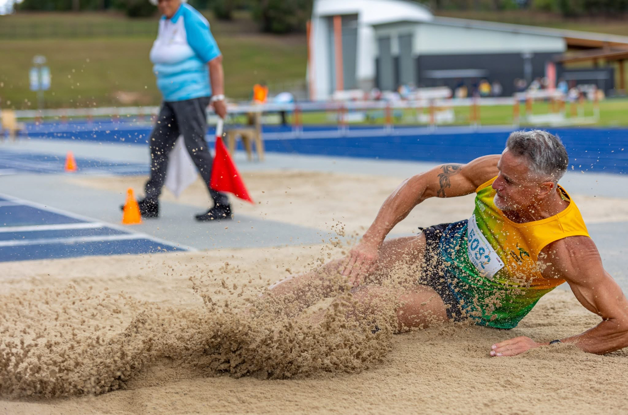 Masters athlete competing in the long jump